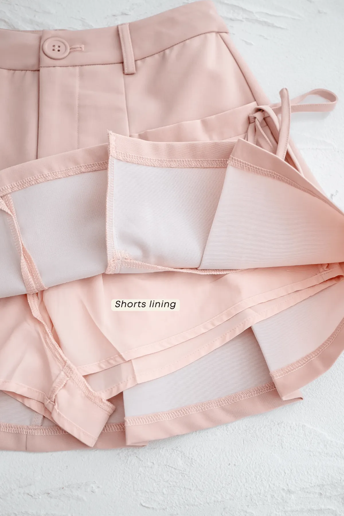 CLARE PLEATED TIE-KNOT SKORTS IN PINK